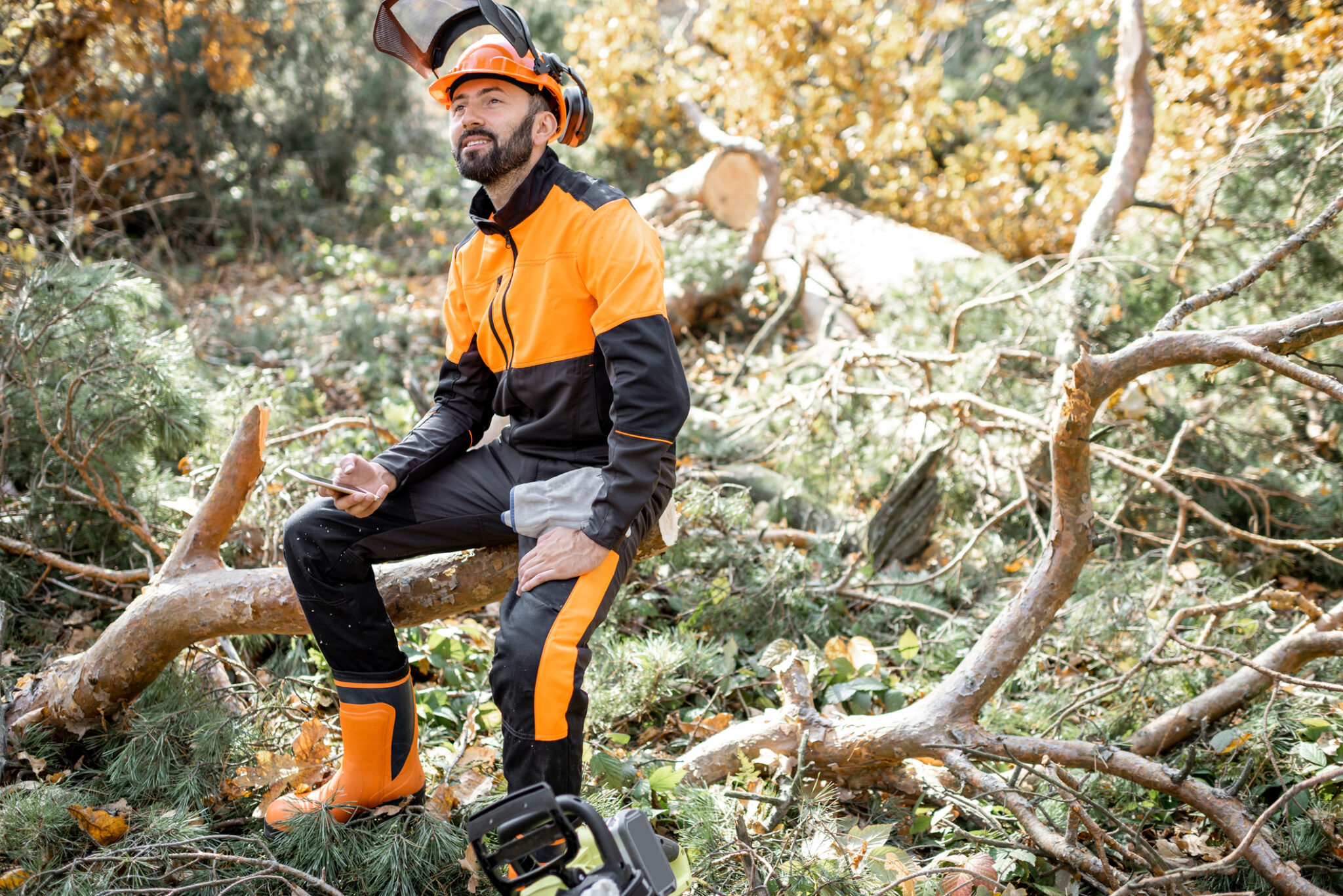 Professional lumberman resting in the forest